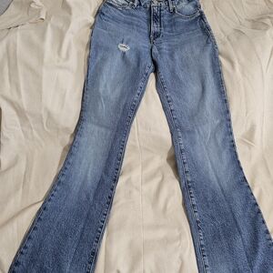 Good American Mid-Blue Flare Jeans with Subtle Distress